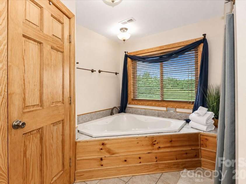 113 Tinker Place, Troutman, NC 28166.  MLS# CAR4384005, YatesRealty ID 26717. Primary Bathroom