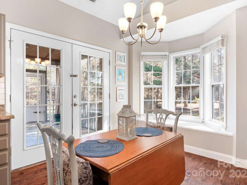 449 Doves Crest Court, Stanley, NC 28164.  MLS# CAR4220525, YatesRealty ID 2672. Dining Area leading to screened porch