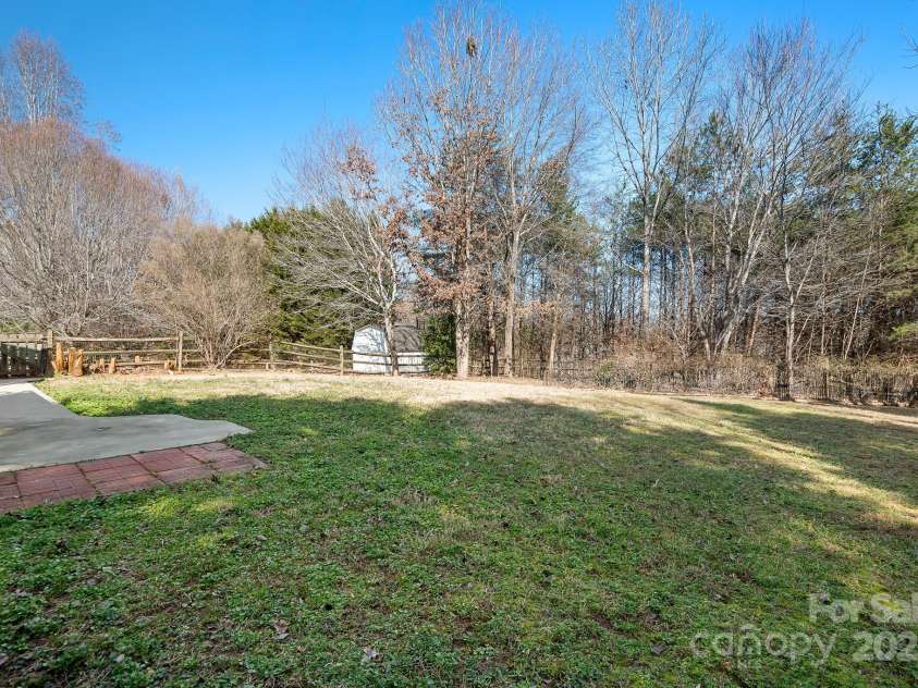 449 Doves Crest Court, Stanley, NC 28164.  MLS# CAR4220525, YatesRealty ID 2672. Level Back yard has great potential.