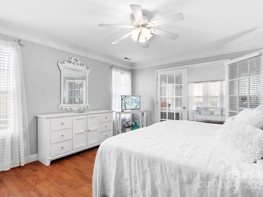 449 Doves Crest Court, Stanley, NC 28164.  MLS# CAR4220525, YatesRealty ID 2672. Spacious Primary Bedroom with access to a large sunroom.