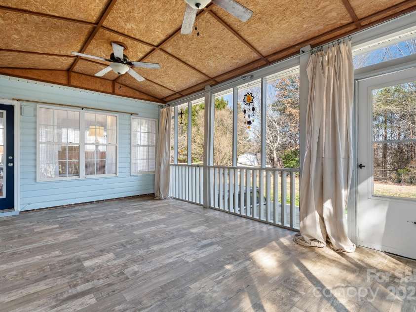 449 Doves Crest Court, Stanley, NC 28164.  MLS# CAR4220525, YatesRealty ID 2672. The large Screened Porch is a great living space.
