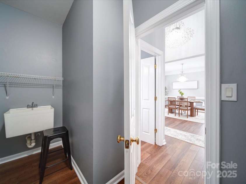 7642 Horseshoe Creek Drive, Huntersville, NC 28078.  MLS# CAR4249944, YatesRealty ID 26720. Main Floor Laundry Room with Utility Sink and Shelving