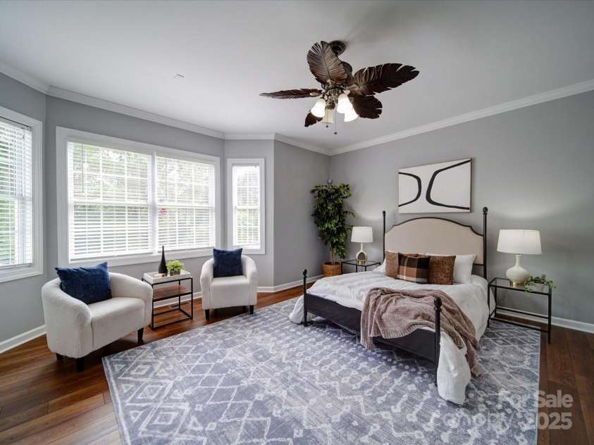 7642 Horseshoe Creek Drive, Huntersville, NC 28078.  MLS# CAR4249944, YatesRealty ID 26720. Primary Bedroom on main.  Notice the sitting area with bay windows