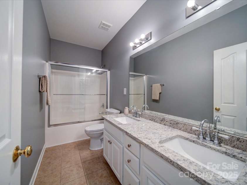 7642 Horseshoe Creek Drive, Huntersville, NC 28078.  MLS# CAR4249944, YatesRealty ID 26720. Third full bath on upper level with dual vanity