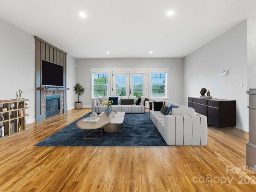 45 Tahkieostie Trail, Asheville, NC 28806.  MLS# CAR4250758, YatesRealty ID 26721. Large living room, open concept to kitchen and front porch. Virtual Staging.