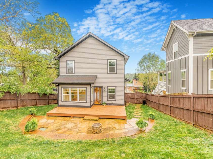 45 Tahkieostie Trail, Asheville, NC 28806.  MLS# CAR4250758, YatesRealty ID 26721. Large, terraced backyard with gas fireplace.