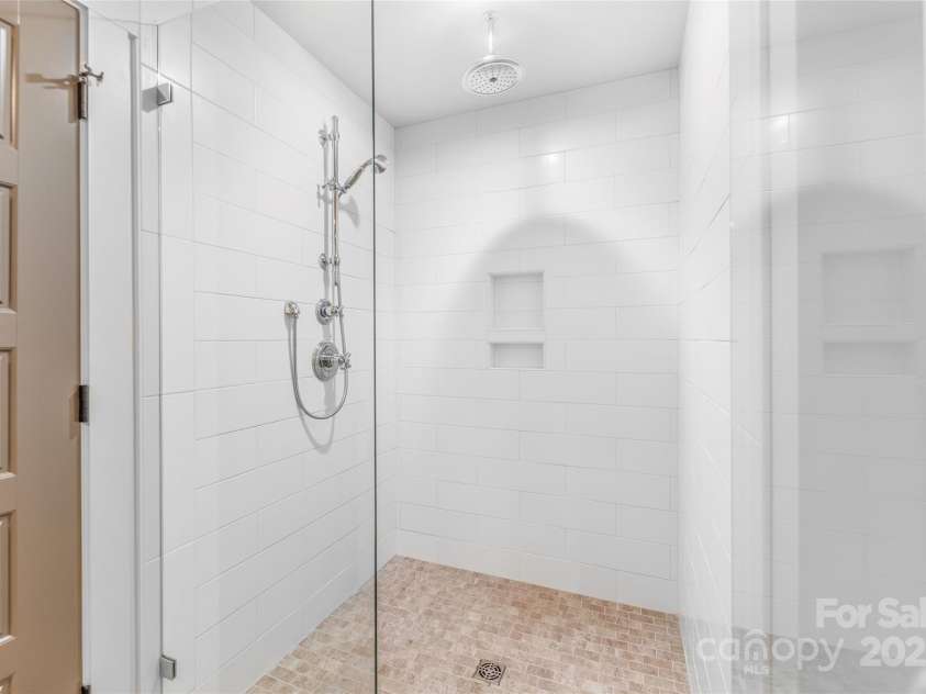 45 Tahkieostie Trail, Asheville, NC 28806.  MLS# CAR4250758, YatesRealty ID 26721. Primary bathroom with walk-in shower.