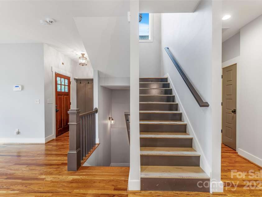 45 Tahkieostie Trail, Asheville, NC 28806.  MLS# CAR4250758, YatesRealty ID 26721. Stairs are centrally located near front door.