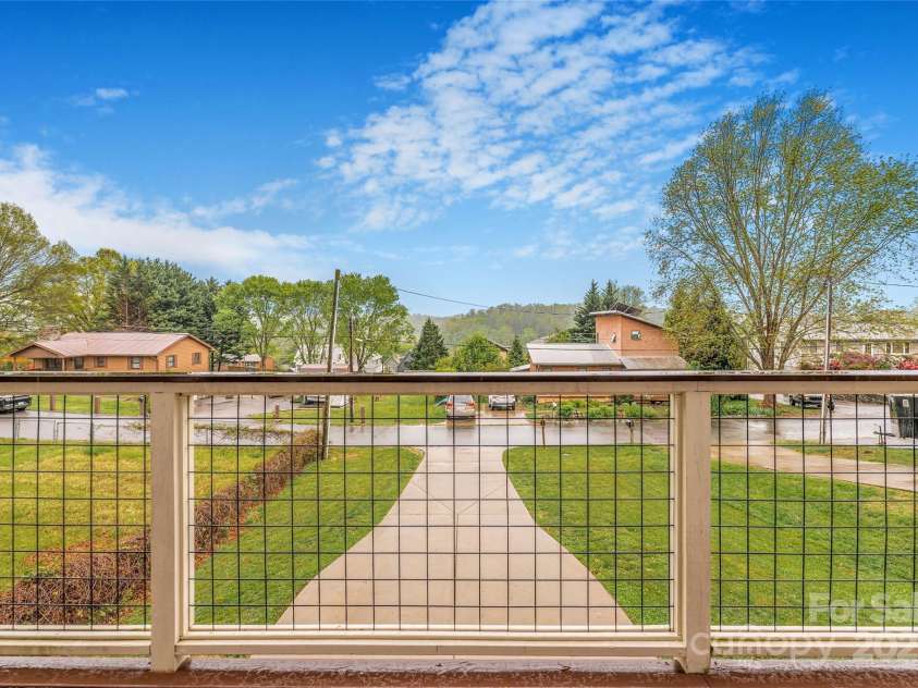 45 Tahkieostie Trail, Asheville, NC 28806.  MLS# CAR4250758, YatesRealty ID 26721. Wrap around front porch with great views.