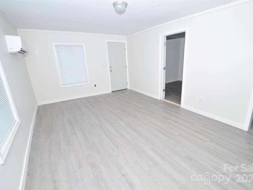 606 Center Street, Lenoir, NC 28645.  MLS# CAR4275846, YatesRealty ID 26723. Roomy living/ dining combo.