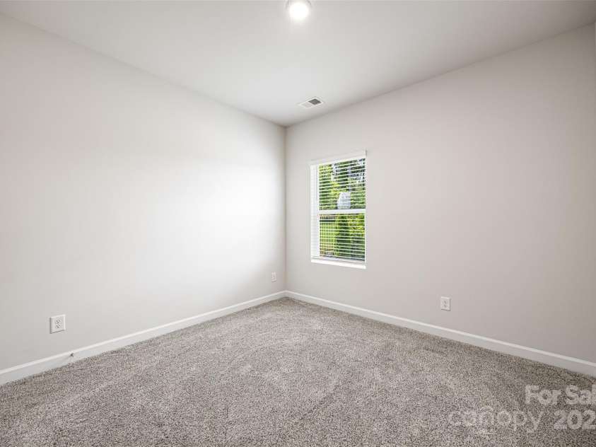 4046 Armstrong Farm Drive, Belmont, NC 28012.  MLS# CAR4274127, YatesRealty ID 26725. First floor guest bedroom