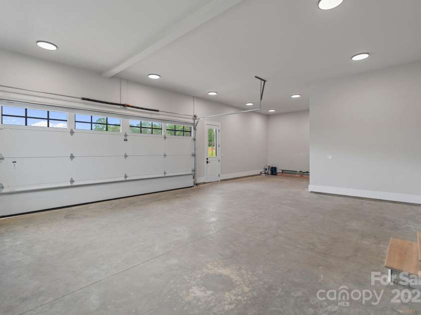 407 Crepe Myrtle Lane, Weddington, NC 28104.  MLS# CAR4200048, YatesRealty ID 2673. Garage with extra bay for work or storage