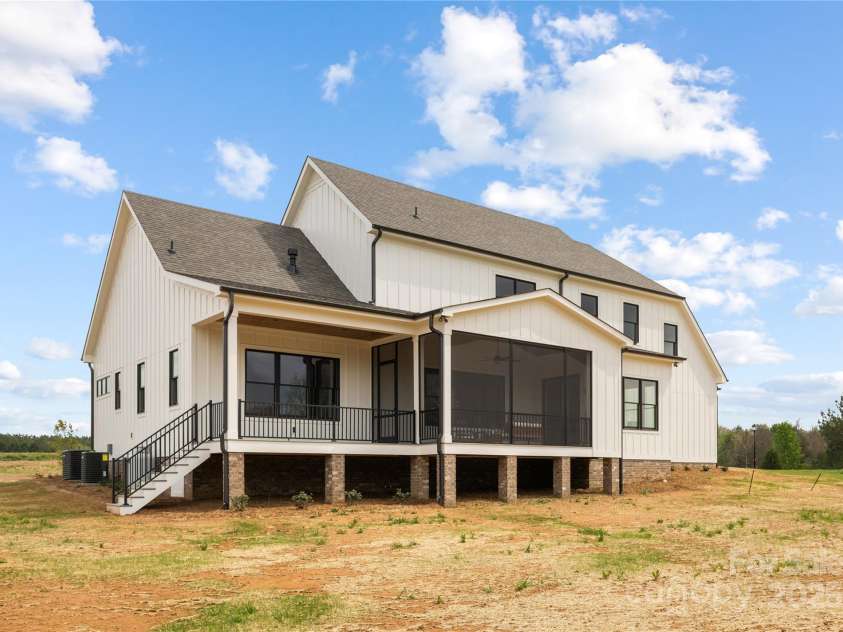 111 Monbo Meadows Lane, Statesville, NC 28677.  MLS# CAR4281404, YatesRealty ID 26730. Back of house with covered porch and screened porch