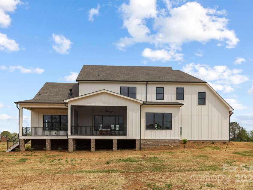 111 Monbo Meadows Lane, Statesville, NC 28677.  MLS# CAR4318689, YatesRealty ID 26730. Back of house with covered porch and screened porch