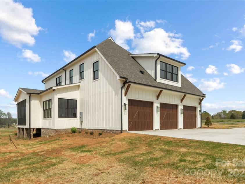 111 Monbo Meadows Lane, Statesville, NC 28677.  MLS# CAR4318689, YatesRealty ID 26730. Side Yard 