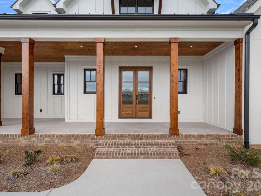 111 Monbo Meadows Lane, Statesville, NC 28677.  MLS# CAR4336887, YatesRealty ID 26730. Enjoy a rocking chair front porch.