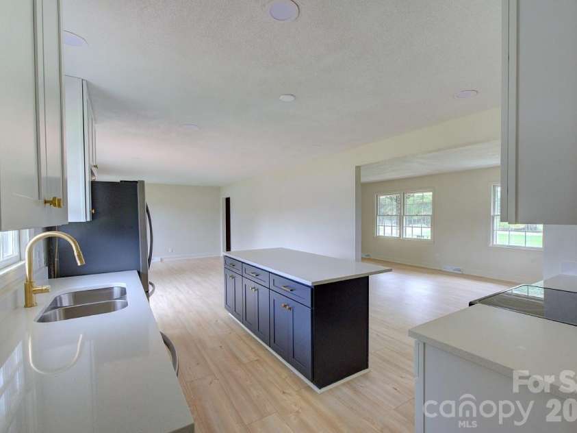 1195 Holly Springs Road, Lyman, SC 29365.  MLS# CAR4387941, YatesRealty ID 26730. Kitchen looking to dining room and den