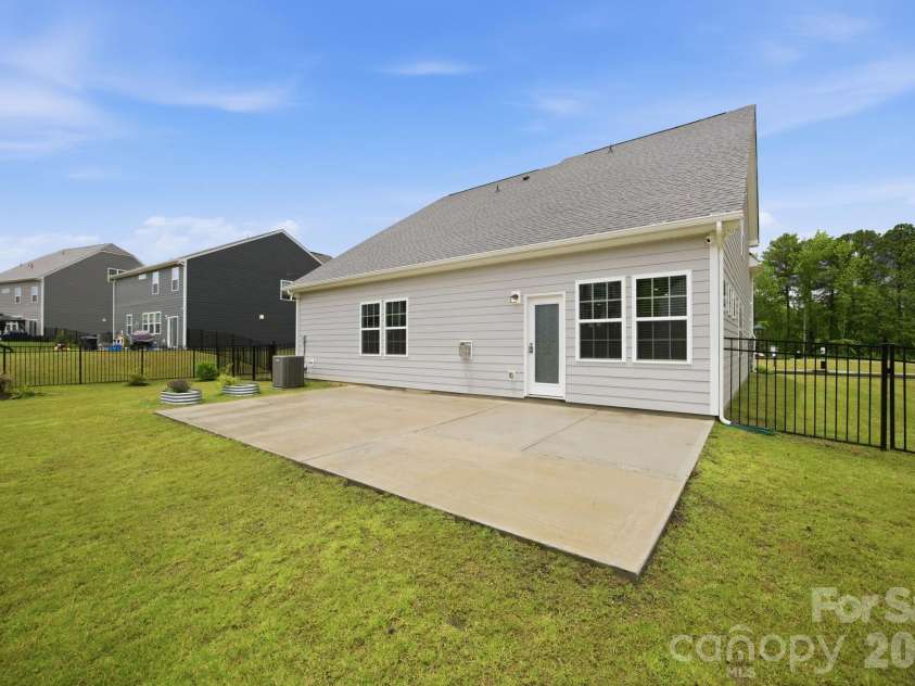 234 Hamptons Cove Road, Troutman, NC 28166.  MLS# CAR4386490, YatesRealty ID 26733. Back Exterior