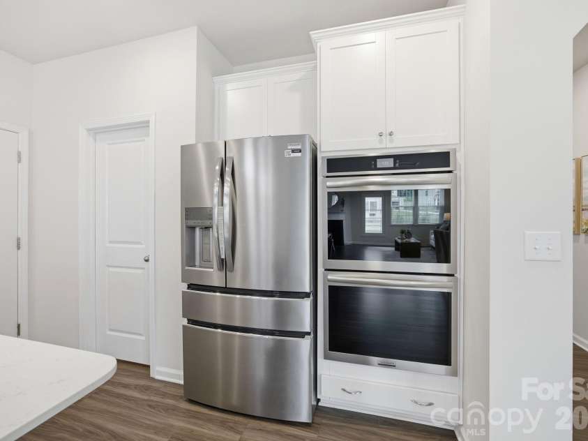 234 Hamptons Cove Road, Troutman, NC 28166.  MLS# CAR4386490, YatesRealty ID 26733. Kitchen with Double Gas Oven