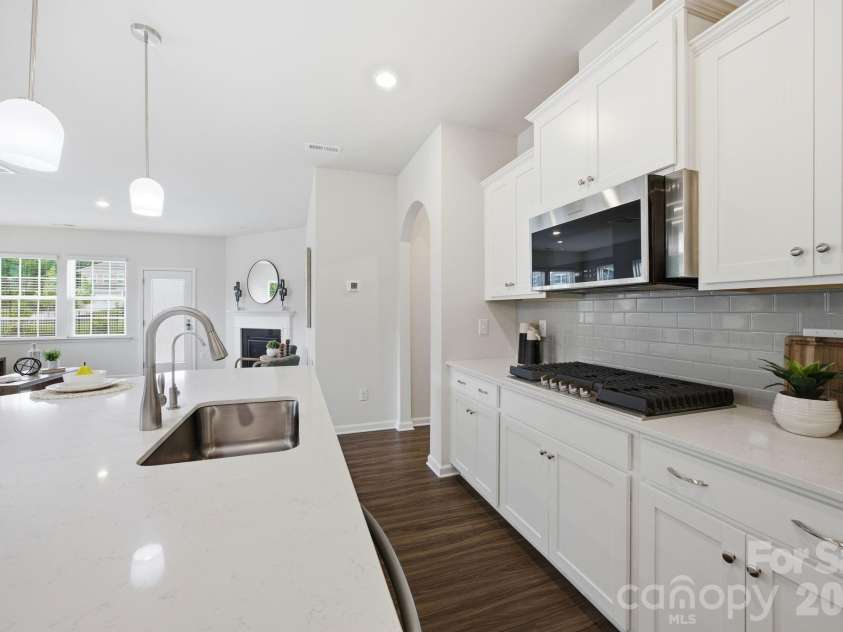 234 Hamptons Cove Road, Troutman, NC 28166.  MLS# CAR4386490, YatesRealty ID 26733. Kitchen with Gas Range