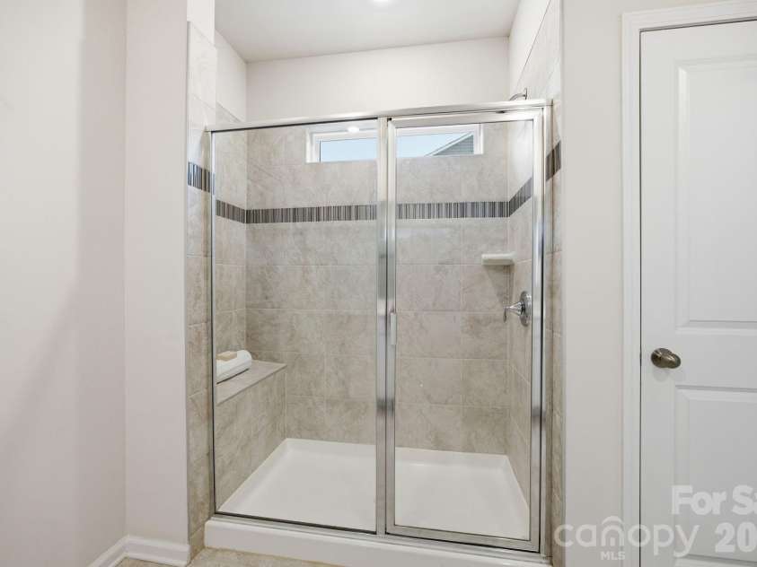 234 Hamptons Cove Road, Troutman, NC 28166.  MLS# CAR4386490, YatesRealty ID 26733. Primary Shower on Main