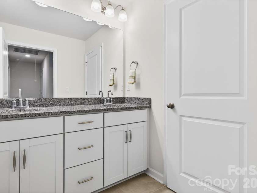 4192 Steel Way, Sherrills Ford, NC 28673.  MLS# CAR4383592, YatesRealty ID 26734. Shared full bath on upper level with dual sinks.