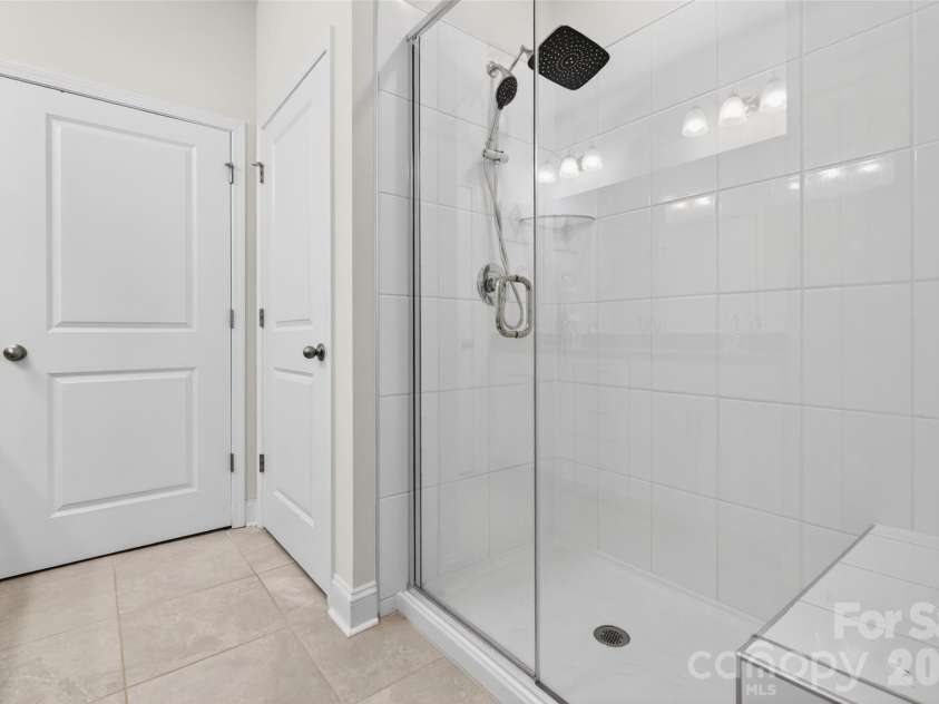 4192 Steel Way, Sherrills Ford, NC 28673.  MLS# CAR4383592, YatesRealty ID 26734. Spacious shower with bench.