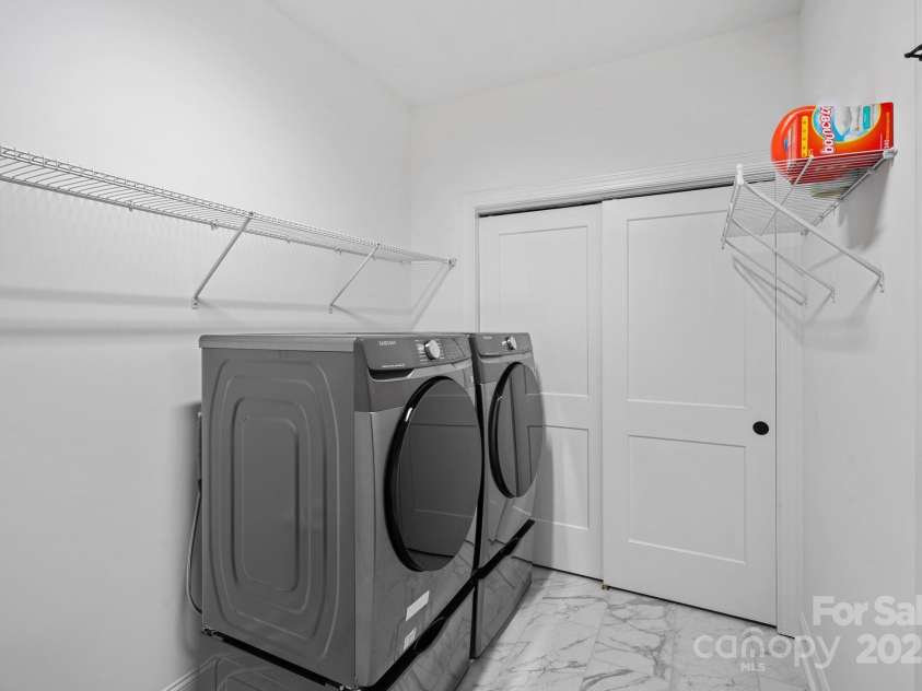 218 Alenda Lux Circle, Mooresville, NC 28115.  MLS# CAR4235396, YatesRealty ID 26739. EXPANDED LAUNDRY ROOM ON MAIN LEVEL WITH HUGE STORAGE CLOSET