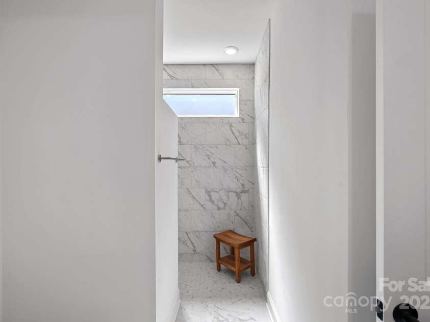218 Alenda Lux Circle, Mooresville, NC 28115.  MLS# CAR4311950, YatesRealty ID 26739. ENTRANCE INTO COVE SHOWER WITH ZERO-GRADE ENTRY FOR ACCESSIBILITY