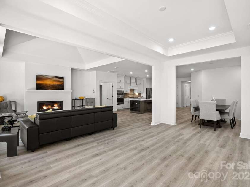 218 Alenda Lux Circle, Mooresville, NC 28115.  MLS# CAR4311950, YatesRealty ID 26739. LOUNGE- NOT YET FURNISHED -LOOKING INTO LIVING ROOM AND DINING ROOM