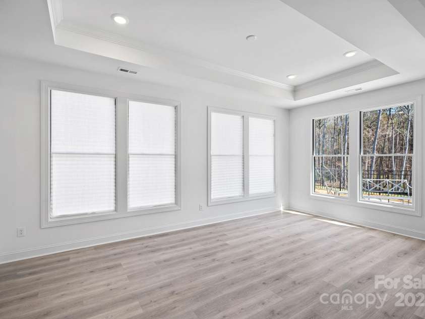 218 Alenda Lux Circle, Mooresville, NC 28115.  MLS# CAR4311950, YatesRealty ID 26739. LOUNGE WITH TRAY CEILING THAT OVER LOOKS THE COURTYARD- NOT FURNISHED