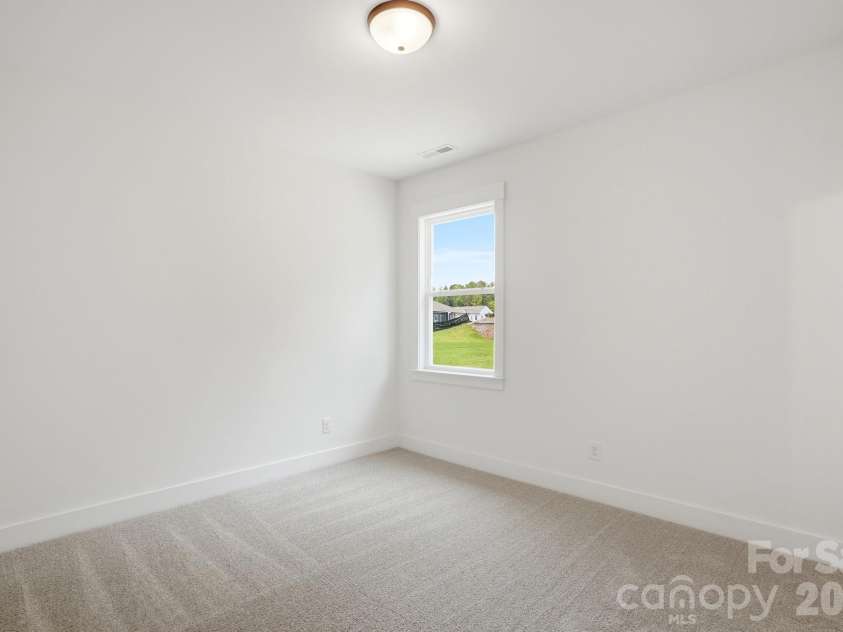 5076 McLaughlin Loop, Waxhaw, NC 28173.  MLS# CAR4334709, YatesRealty ID 26740. Guest Bedroom