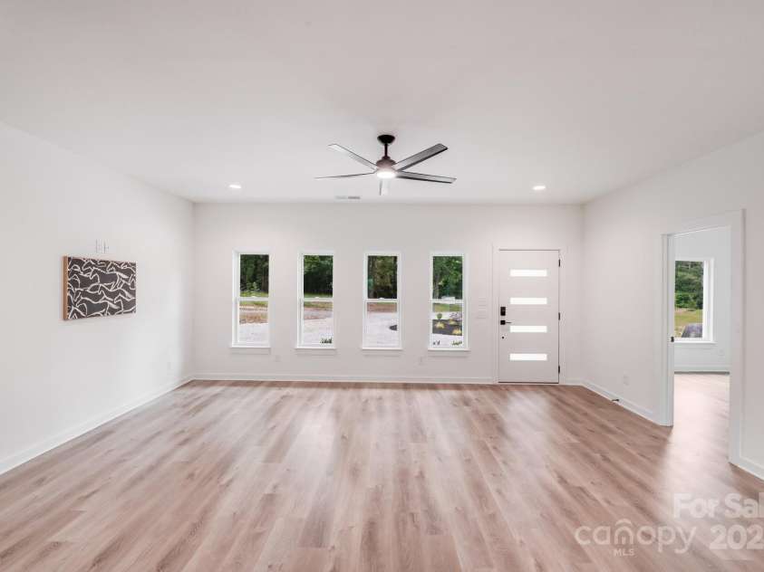 6907 Lancaster Highway, Waxhaw, NC 28173.  MLS# CAR4247480, YatesRealty ID 26742. Flooded with natural light and finished with sleek modern touches, the bright, open great room offers the perfect space for gathering, relaxing, and enjoying modern living at its finest.