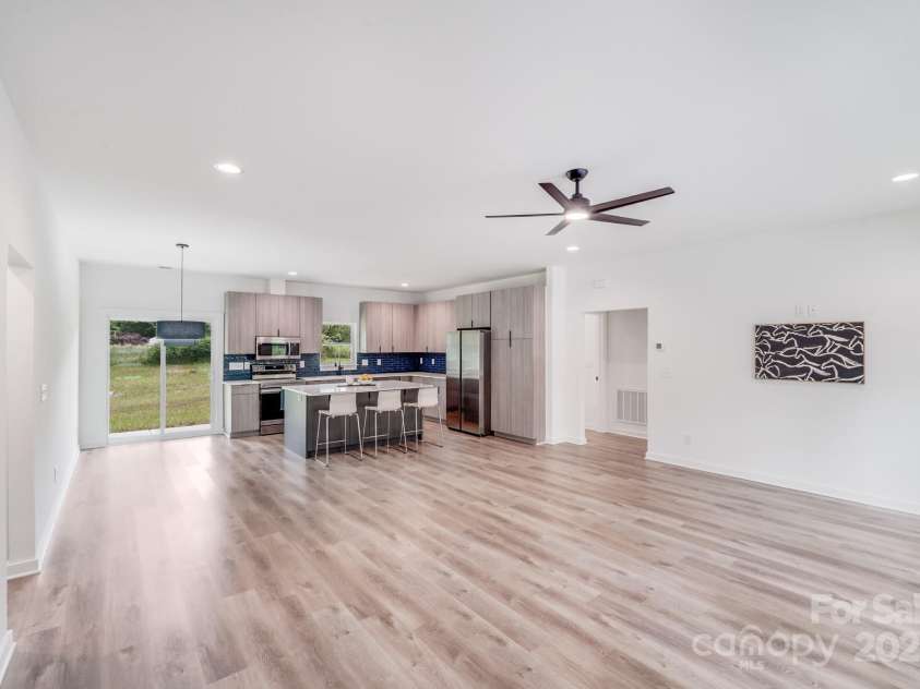 6907 Lancaster Highway, Waxhaw, NC 28173.  MLS# CAR4247480, YatesRealty ID 26742. Just to the right of the kitchen, a door leads to a private hallway that brings you to the spacious master bedroom, offering a quiet escape from the main living areas.