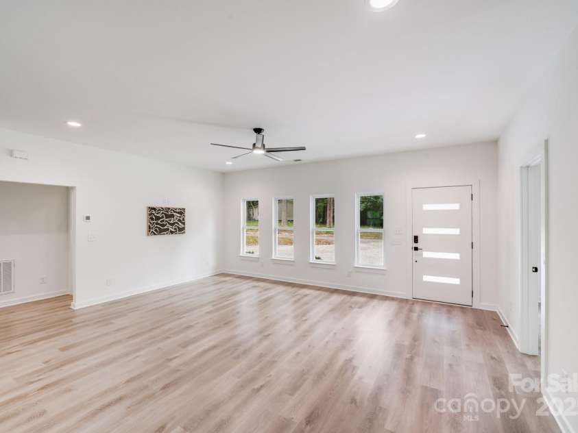 6907 Lancaster Highway, Waxhaw, NC 28173.  MLS# CAR4247480, YatesRealty ID 26742. The home features recessed lighting throughout the main living areas, a sleek black ceiling fan in the great room, creating a bright, stylish, and inviting atmosphere.