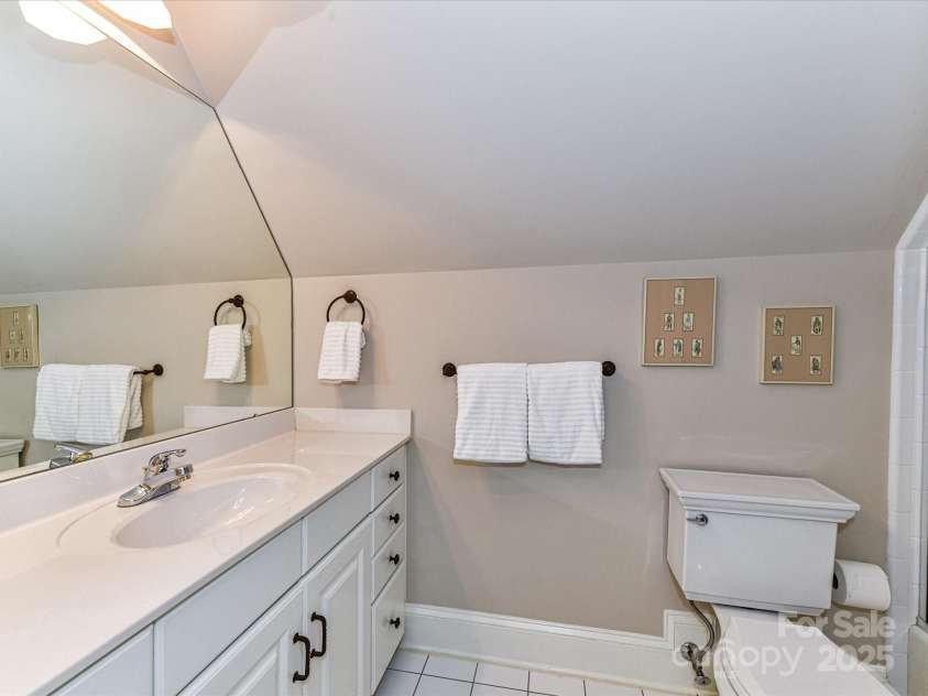 14650 Trading Path Way, Charlotte, NC 28277.  MLS# CAR4249159, YatesRealty ID 26743. All white tiled bathroom