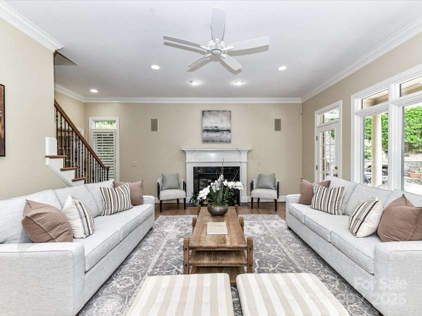 14650 Trading Path Way, Charlotte, NC 28277.  MLS# CAR4249159, YatesRealty ID 26743. The Living Room is centered on a fireplace- flalnked by french doors and windows overlooking the backyard