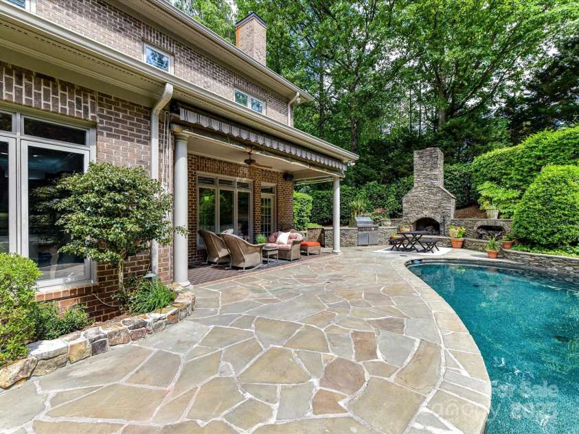 14650 Trading Path Way, Charlotte, NC 28277.  MLS# CAR4249159, YatesRealty ID 26743. The stone patio extends beyond the covered porch