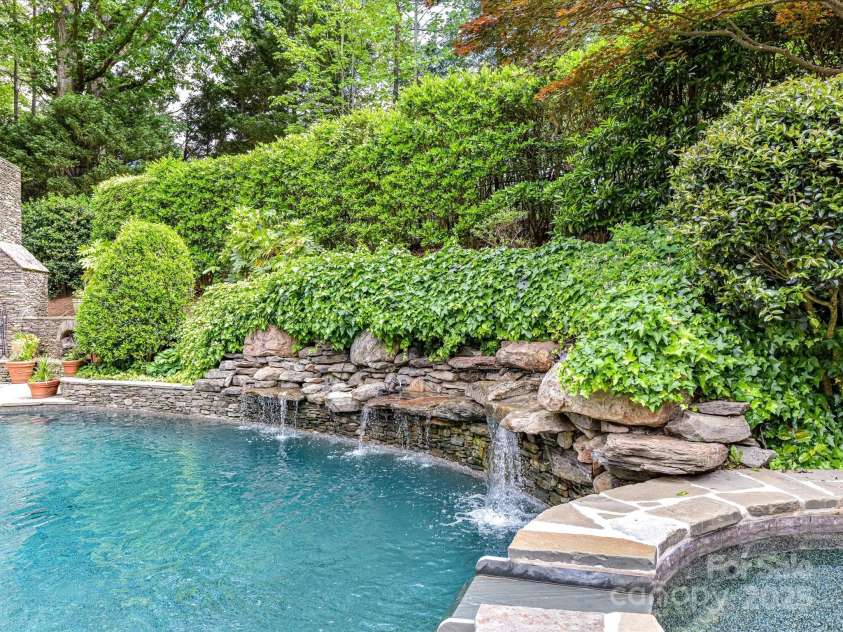 14650 Trading Path Way, Charlotte, NC 28277.  MLS# CAR4249159, YatesRealty ID 26743. Waterfall features over the rocks- what a lovely water sound