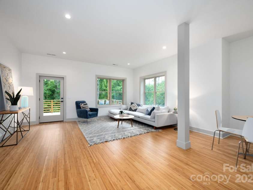 11 Middlebrook Road, Asheville, NC 28805.  MLS# CAR4259341, YatesRealty ID 26744. Basement Living Room with Tall Ceiling and Deck Access