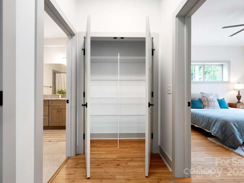 11 Middlebrook Road, Asheville, NC 28805.  MLS# CAR4259341, YatesRealty ID 26744. Oversized Linen Closet In Basement