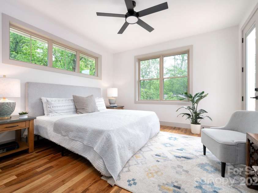 11 Middlebrook Road, Asheville, NC 28805.  MLS# CAR4259341, YatesRealty ID 26744. Spacious Primary Suite Features a Clerestory Window and Private Deck Access