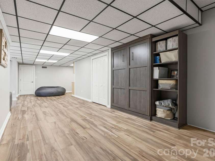226 28th Avenue Place, Hickory, NC 28601.  MLS# CAR4386379, YatesRealty ID 26747. Basement Open Concept Rec Area/Murphy Bed View