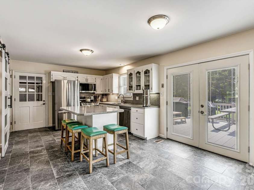 226 28th Avenue Place, Hickory, NC 28601.  MLS# CAR4386379, YatesRealty ID 26747. Focused Kitchen/Back Deck Entry View (New Tile Floor)