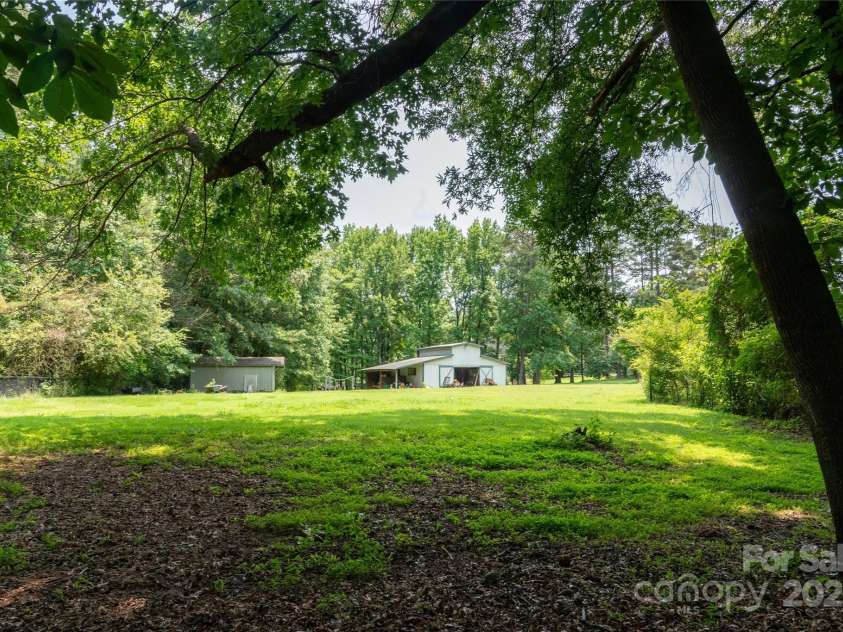 315 Red Barn Trail, Matthews, NC 28104.  MLS# CAR4267692, YatesRealty ID 26749. Rear of property wth barn