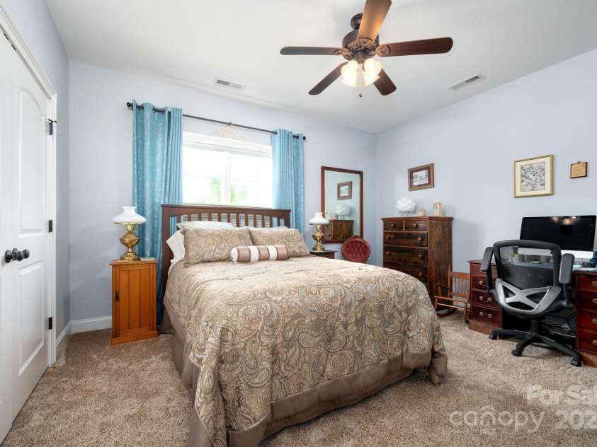 12 Asher Lane, Arden, NC 28704.  MLS# CAR4272445, YatesRealty ID 26758.  Bedroom with Cozy Carpet and Ceiling Fan