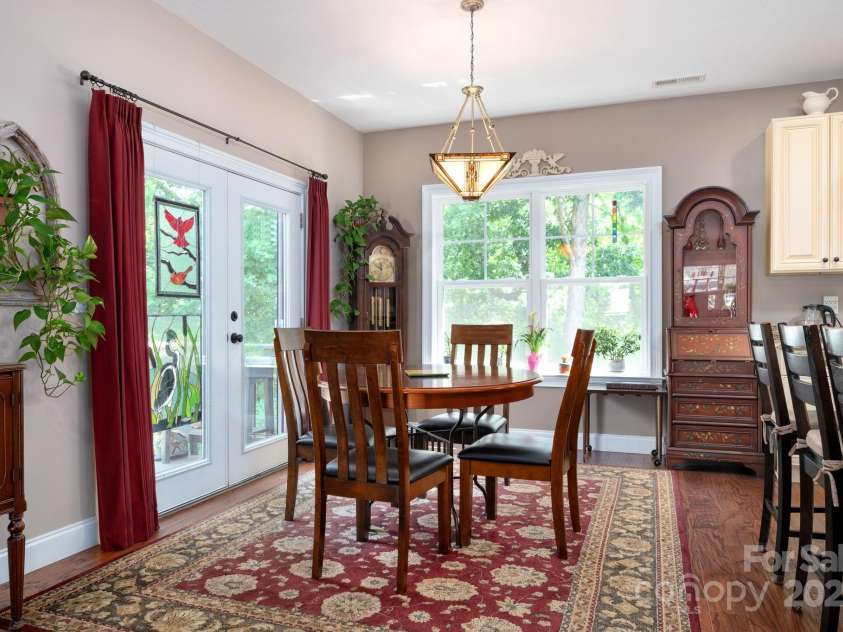 12 Asher Lane, Arden, NC 28704.  MLS# CAR4272445, YatesRealty ID 26758. Dining Area Off of Kitchen and Deck Access