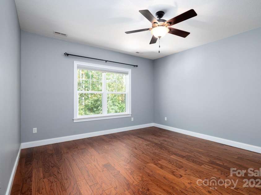 12 Asher Lane, Arden, NC 28704.  MLS# CAR4272445, YatesRealty ID 26758. Main Level Primary Suite with Hardwood Flooring