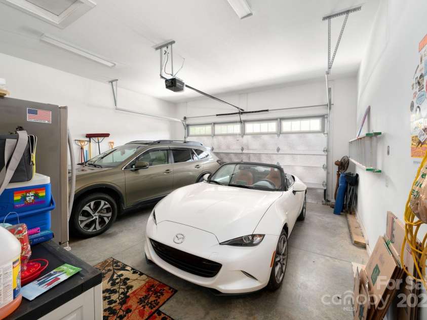 12 Asher Lane, Arden, NC 28704.  MLS# CAR4272445, YatesRealty ID 26758. Oversized Two-Car Garage with Extra Storage