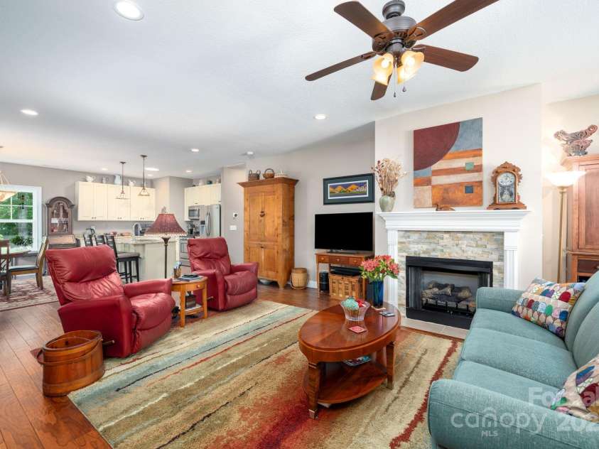 12 Asher Lane, Arden, NC 28704.  MLS# CAR4272445, YatesRealty ID 26758. Spacious Living Room with Cut Stone-Surround Gas Fireplace